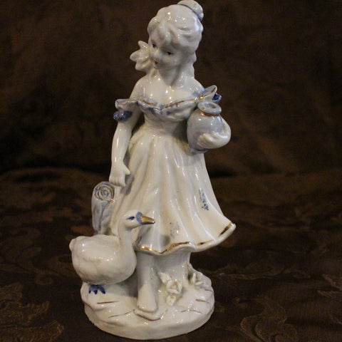 Gorgeous Vintage Girl with Goose Porcelain Figurine with blue and gold accents