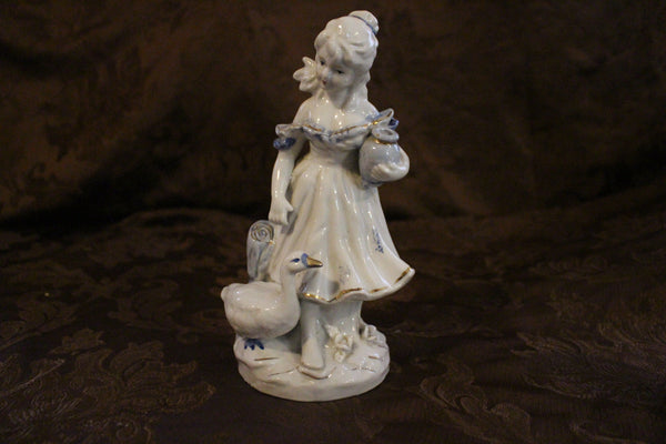 Gorgeous Vintage Girl with Goose Porcelain Figurine with blue and gold accents