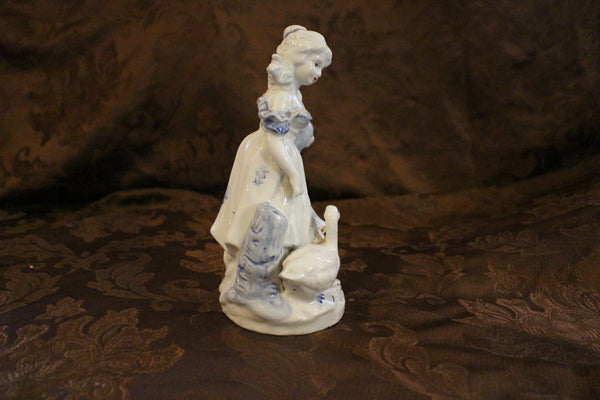Gorgeous Vintage Girl with Goose Porcelain Figurine with blue and gold accents