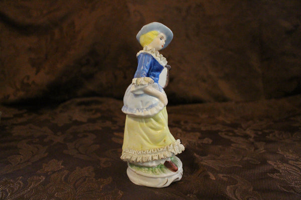 Dama victoriana vintage de porcelana con lira